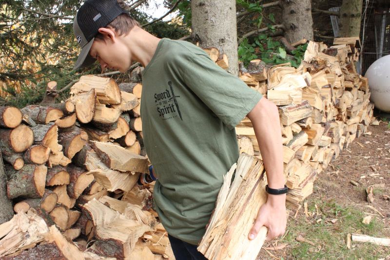 Carrying firewood in the Sword of the Spirit tee