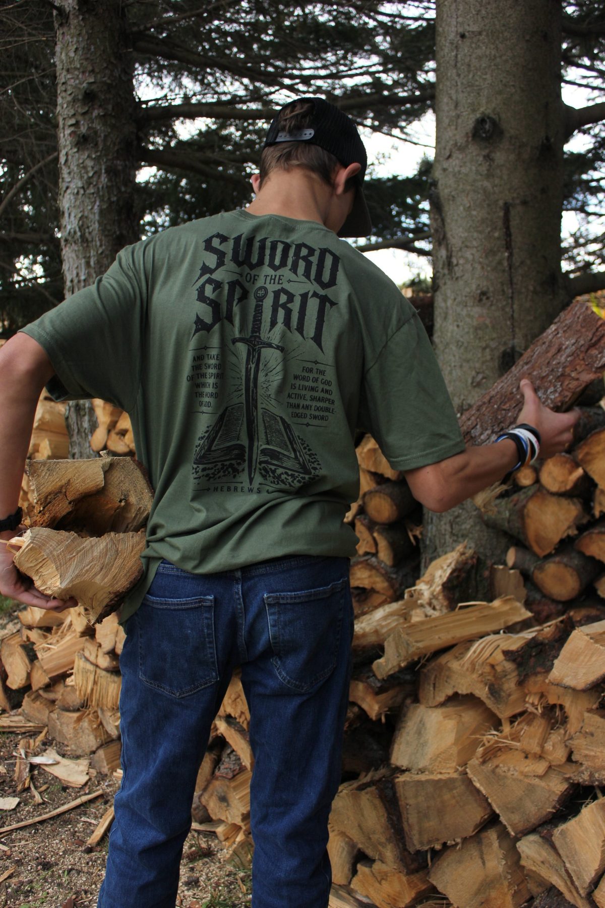 Back print, standing by the woodpile